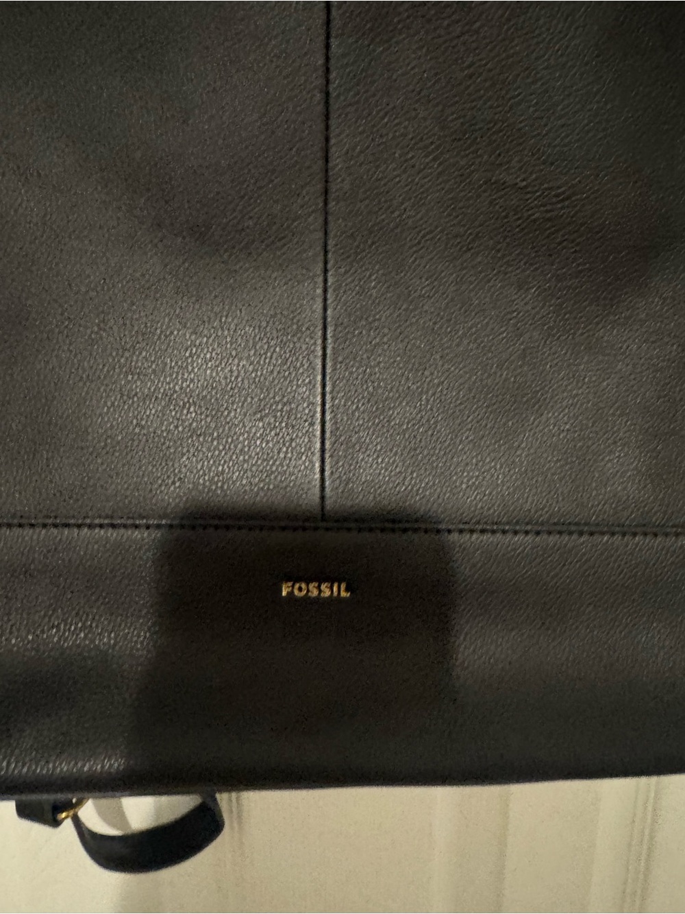 Fossil Black Leather Knapsack. Backside includes hidden pocket.